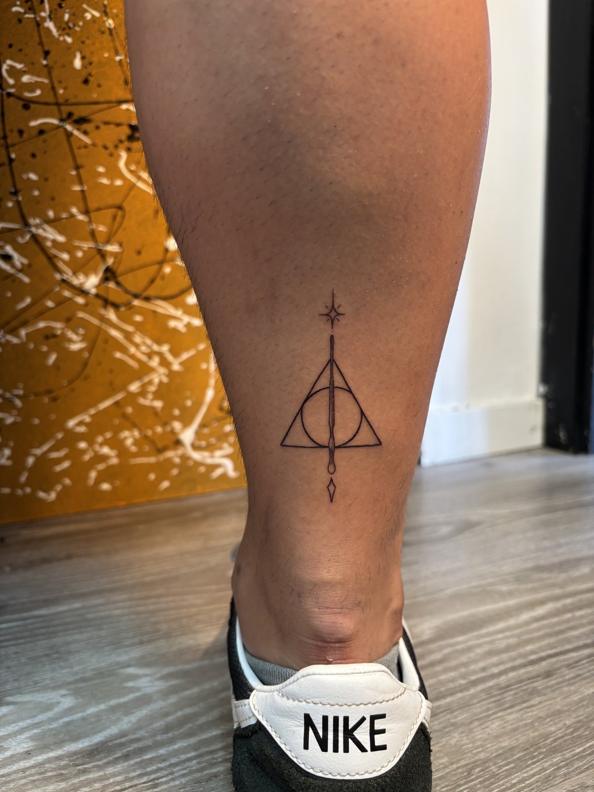 Fine line Deathly Hallows symbol tattoo